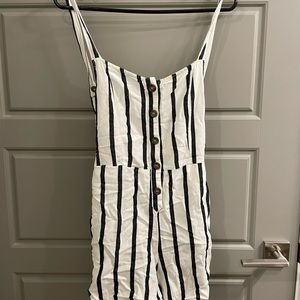 Small striped romper, bow tie in back